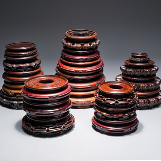 A collection of 20 Chinese wooden stands, 19/20th C.