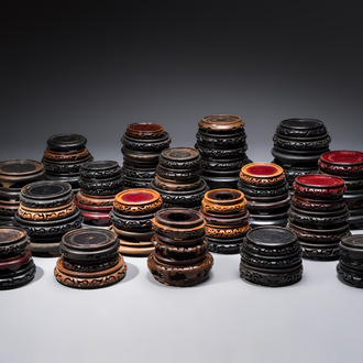 A collection of 80 Chinese wooden stands, 19/20th C.