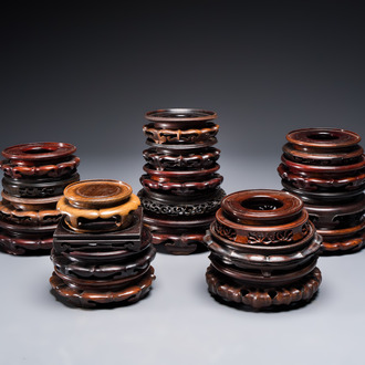A collection of 20 Chinese wooden stands, 19/20th C.