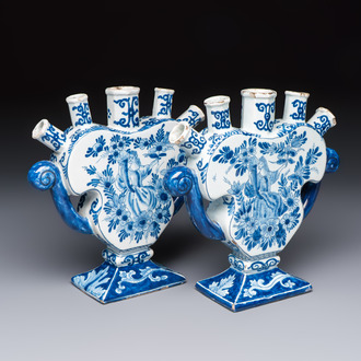 A pair of blue and white Dutch Delft tulip vases with a lady holding a cornucopia, 19th C.