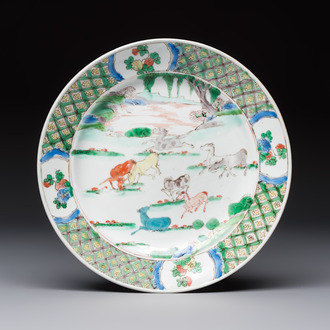 A Chinese famille verte 'Eight Horses' plate, Kangxi