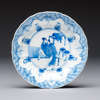 A Chinese blue and white 'Erotic Subject' saucer, Chenghua mark, Kangxi