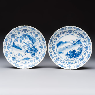 A pair of Chinese blue and white 'Hunting' plates, Chenghua marks, Kangxi