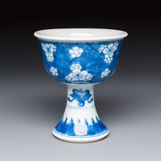 A Chinese blue and white 'Prunus on Cracked Ice' stem bowl, Kangxi