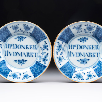 A pair of blue and white Dutch Delft inscribed plates, 18th C.