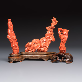 Three Chinese red coral carvings on wooden stands, 19/20th C.