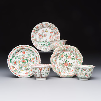 Three sets of Chinese famille verte cups and saucers with birds and flowers, various marks, Kangxi