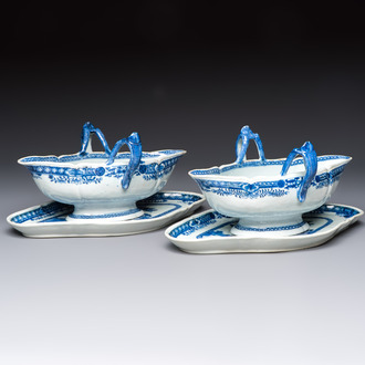 A pair of Chinese blue and white handled sauce boats and stands with pagodas along a river, Qianlong