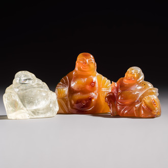 A Chinese carved rock crystal Milefo Buddha and two agate Milefo Buddhas, 19/20th C.
