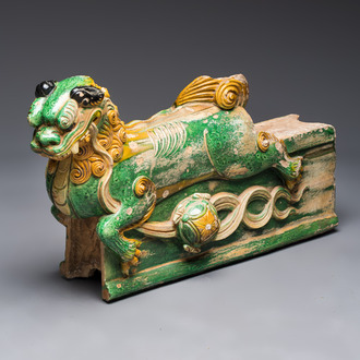 A large Chinese sancai-glazed pottery 'Buddhist Lion' roof tile, Ming