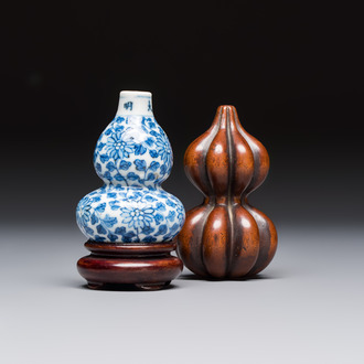 A Chinese blue and white double-gourd snuff bottle and a huali snuff bottle, Xuande and Qianlong mark, 19th C.