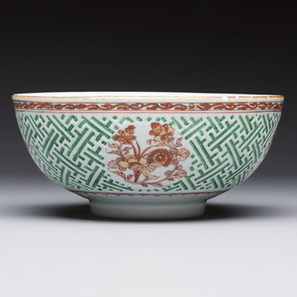A Chinese famille verte relief-carved bowl with gilt iron-red floral design, Kangxi