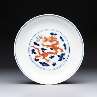 A Chinese blue and white iron-red-decorated 'Dragon' plate, Jing Jin Tang 精進堂 mark, 19th C.