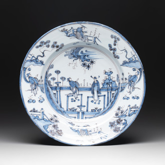 A blue and white 'figures in a garden' chinoiserie dish, Frankfurt, 17th C.