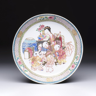 A fine Chinese famille rose eggshell plate with a lady and playing boys, Yongzheng