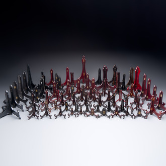 A collection of 75 Chinese folding wooden plate stands, 20th C.