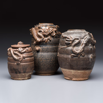 Three Chinese brown-glazed jars with an applied dragon design, one with cover, Song