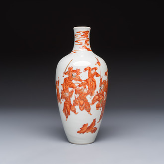 A Chinese iron-red and gilt-decorated vase with a narrative design, Qianlong mark, 19th C.