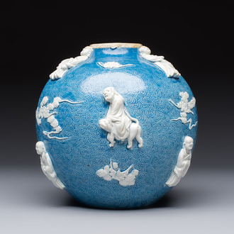 A Chinese sgraffiato blue-ground 'Luohan' vase with relief design, 19th C.