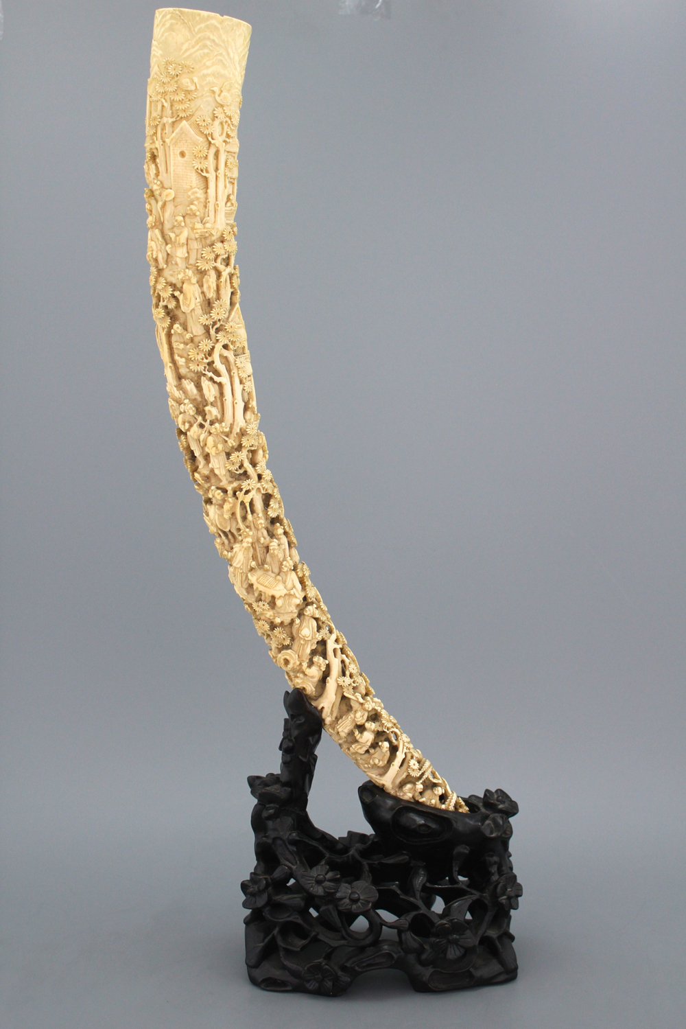 An important Chinese carved ivory tusk on stand, 19th C.