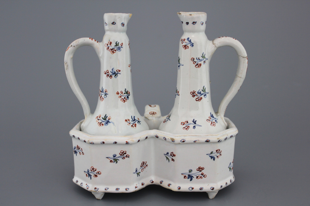 A Brussels faience cruet set, decor "A l'haie fleurie", 18th C.