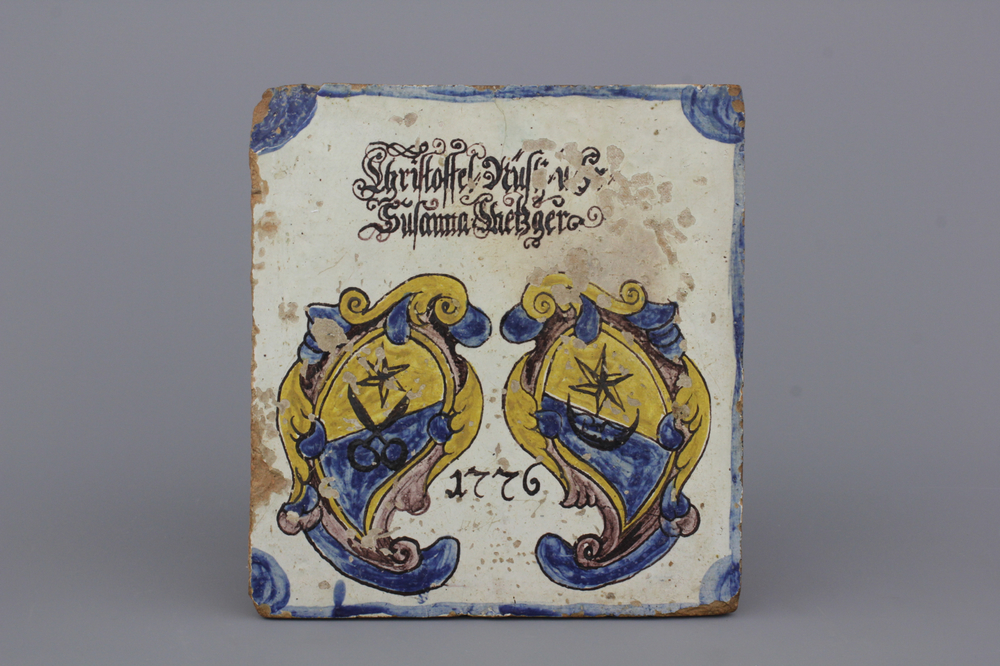 A German armorial stove tile, dated 1776 and inscribed