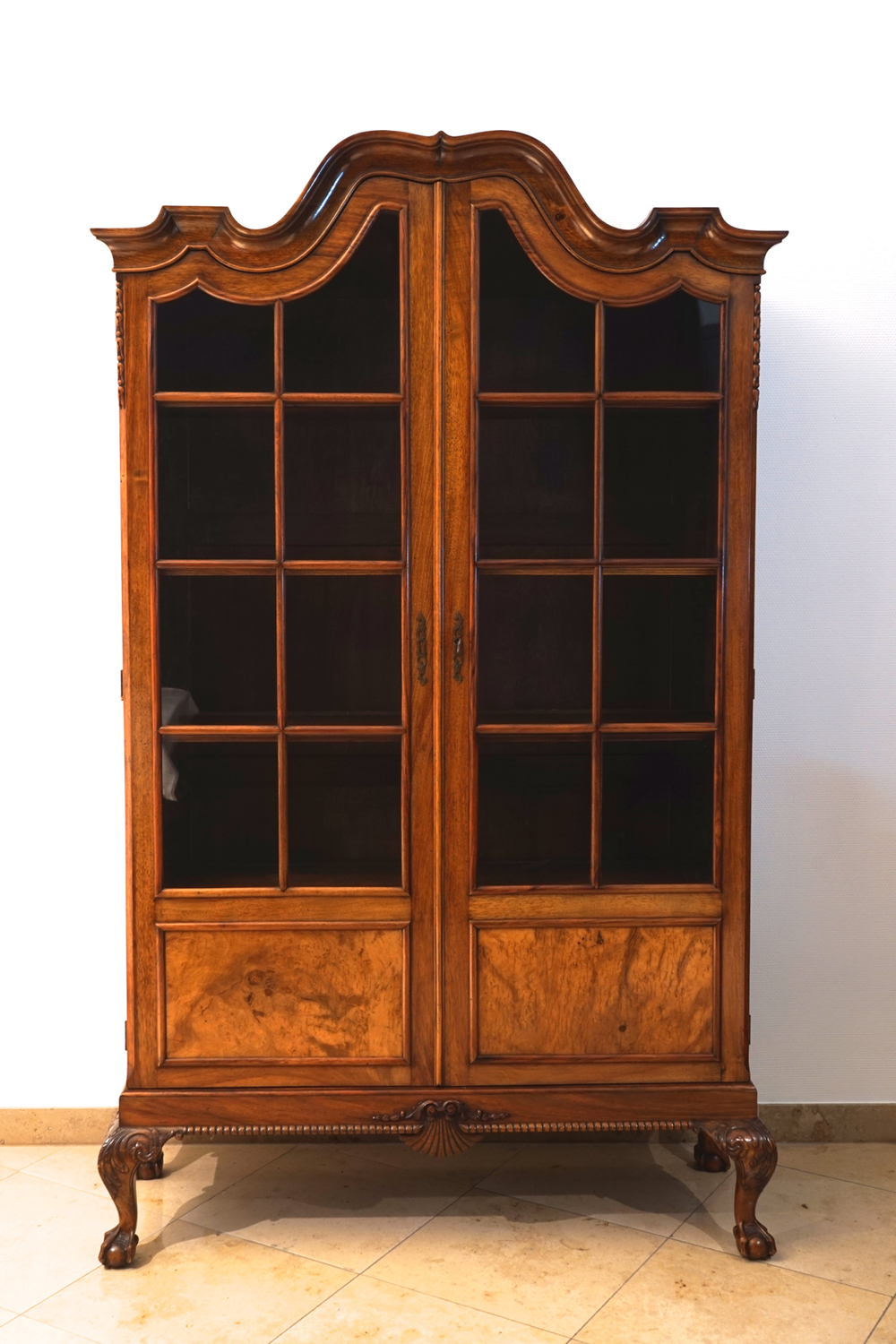 An English Chippendale style walnut veneer display cabinet, 19th C.