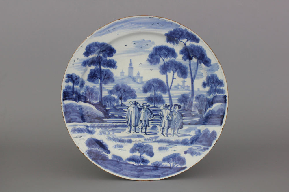 A Dutch Delft blue and white dish with a fine "open air" decoration, ca. 1720