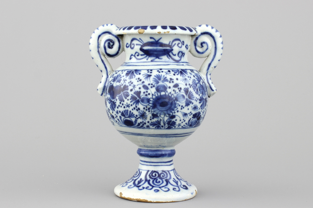 A Dutch Delft blue and white altar vase, early 18th C.