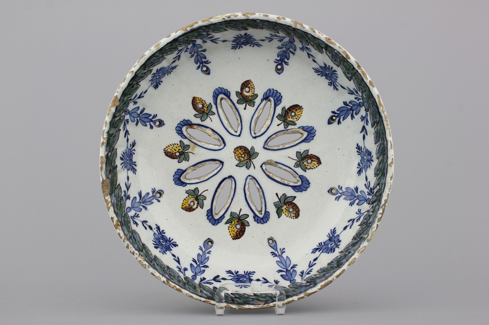 A Dutch Delft polychrome strawberry strainer, 18th C.