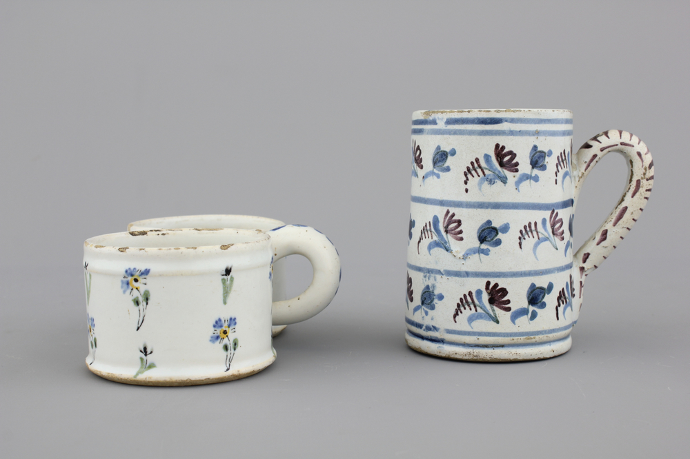 A French faience tankard and a cruet set stand, 18th C.
