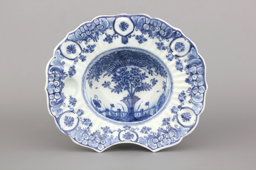 A Dutch Delft blue and white "tea tree" pattern barber's bowl, 18th C.