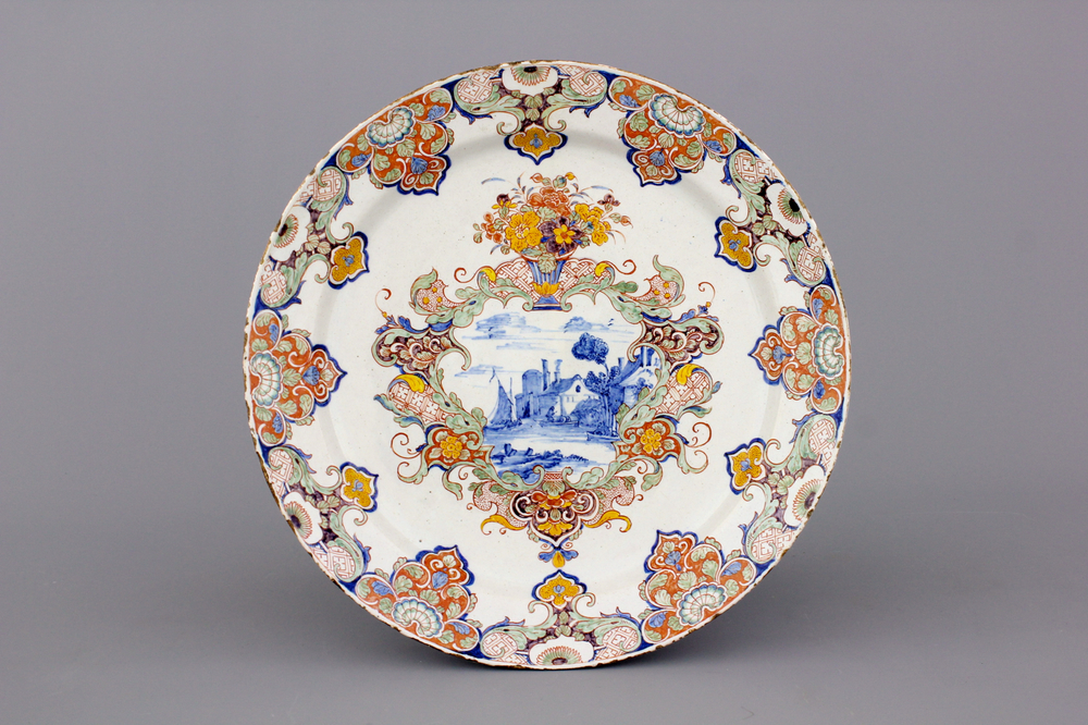 A very fine Dutch Delft polychrome dish with a landscape scene, 18th C.