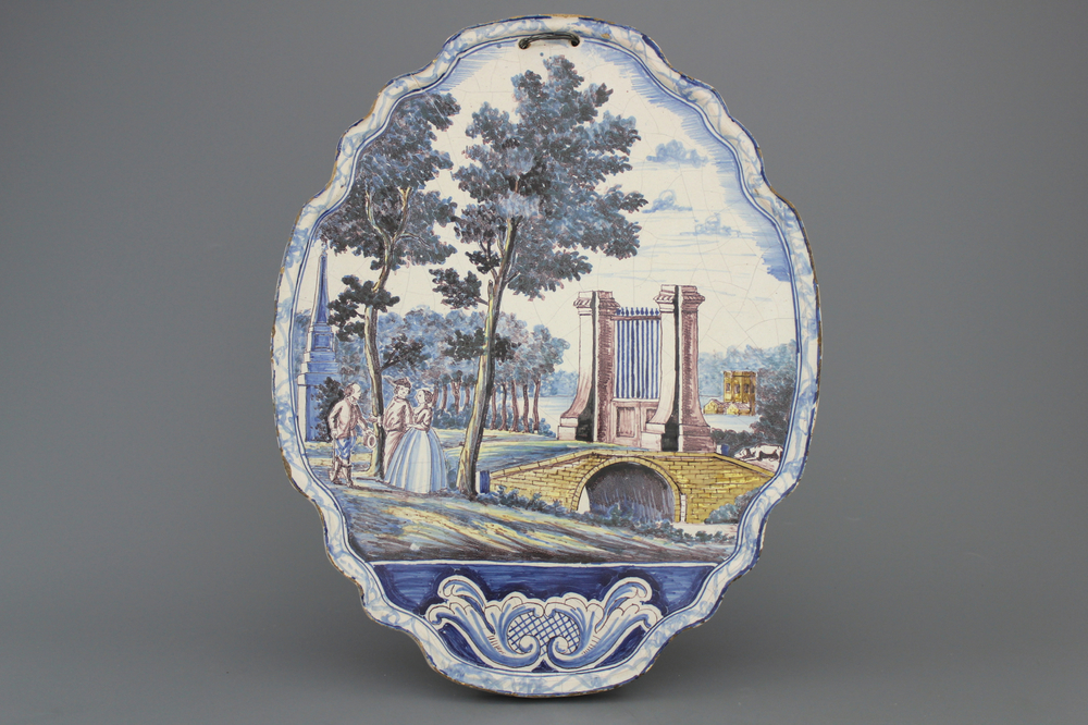 A Dutch Delft polychrome plaque, 19th C.