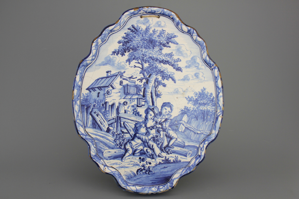 A Dutch Delft Makkum blue and white romantic plaque, 19th C.