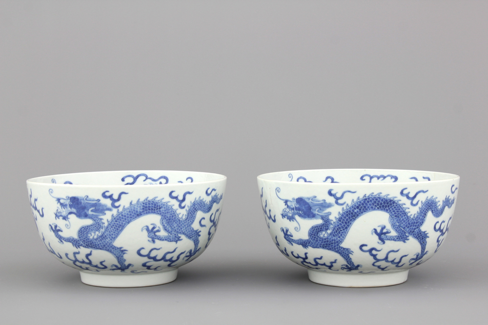 A pair of Chinese porcelain blue and white dragon bowls, 19th C.