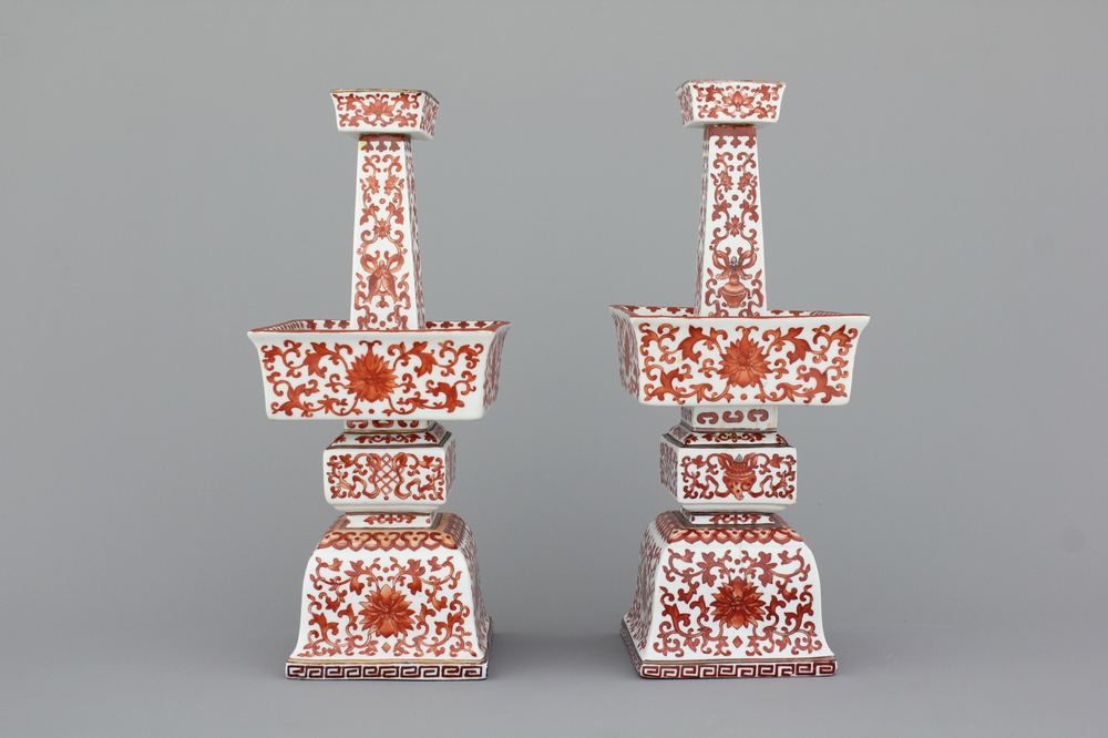A pair of Chinese porcelain coral red decorated altar candlesticks, 19th C.