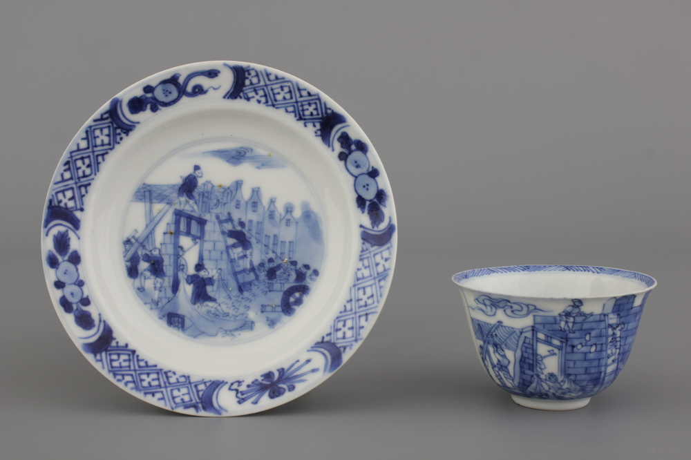A Chinese porcelain blue and white cup and saucer with a "Rotterdam Riot" decor, Kangxi