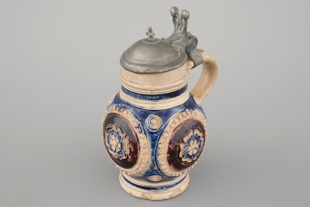 A manganese and blue Westerwald pewter-mounted globular jug, 17th C.