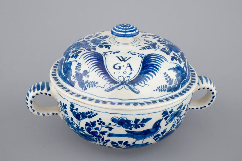 A dated Dutch Delft blue and white round bowl with cover for spiced wine, ca. 1709
