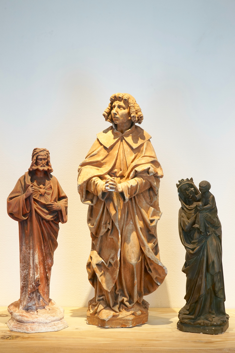 Three plaster casts of religious figures, 19/20th C., Bruges
