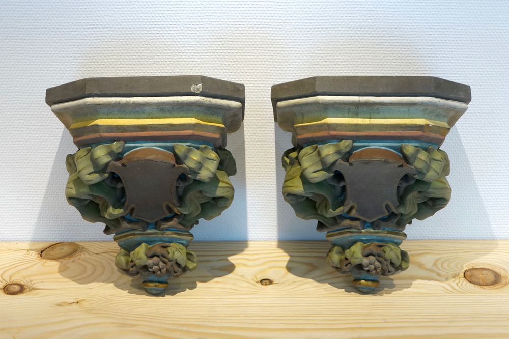 A pair of polychrome plaster consoles, 19/20th C., Bruges
