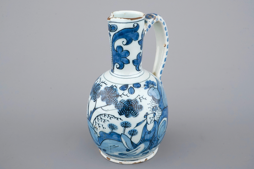 A Dutch Delft blue and white chinoiserie jug, 17th C.