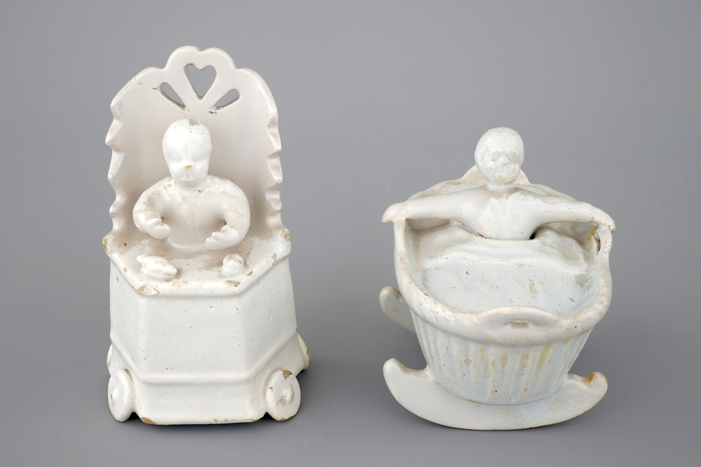 Two monochrome white Dutch Delft figures of children, 18th C.