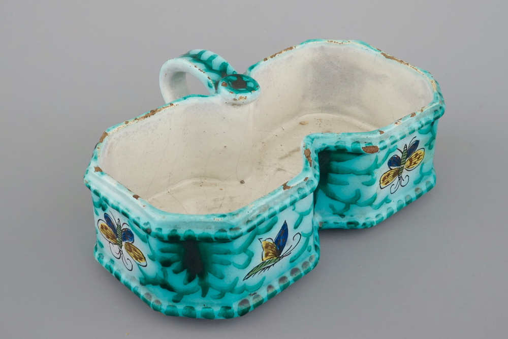 A Brussels faience cruet stand with butterfly design, 18th C.