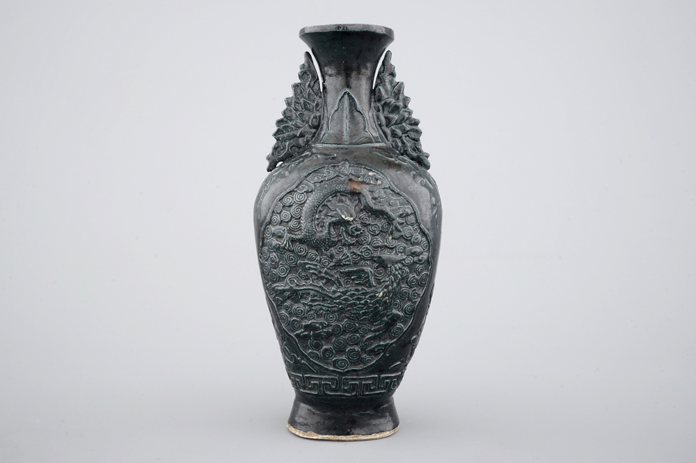 A Chinese black glazed relief-moulded vase, 19/20th C.