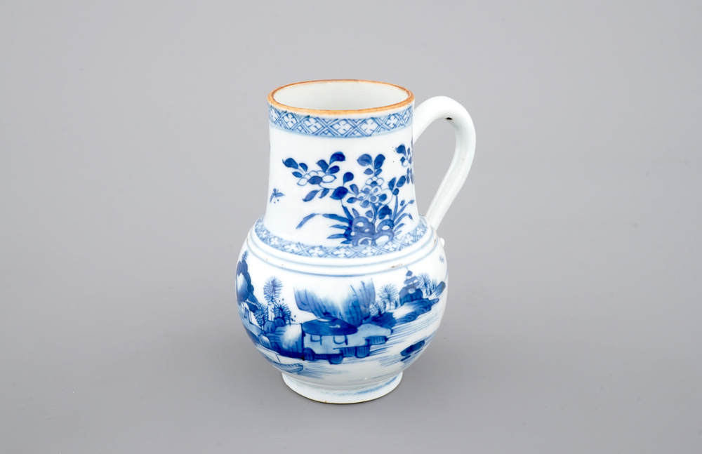 A Chinese blue and white jug with figures in a landscape, 18th C.