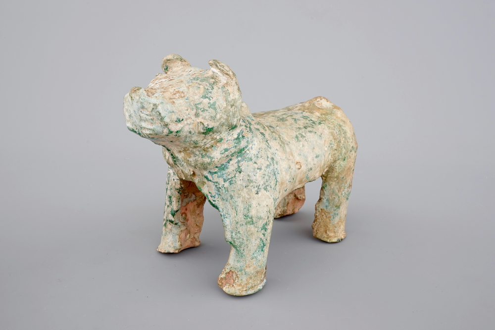 A Chinese green glazed pottery figure of a dog, presumably Han Dynasty