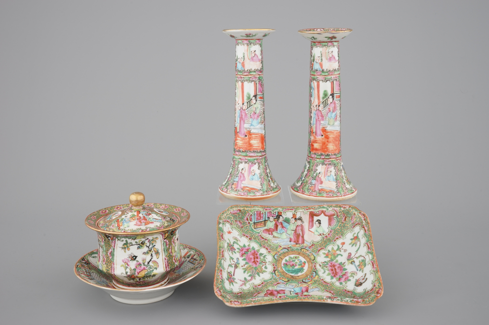 A group of Chinese Canton famille rose wares: a pair of candlesticks, a covered bowl on stand and a oblong tray, 19th C