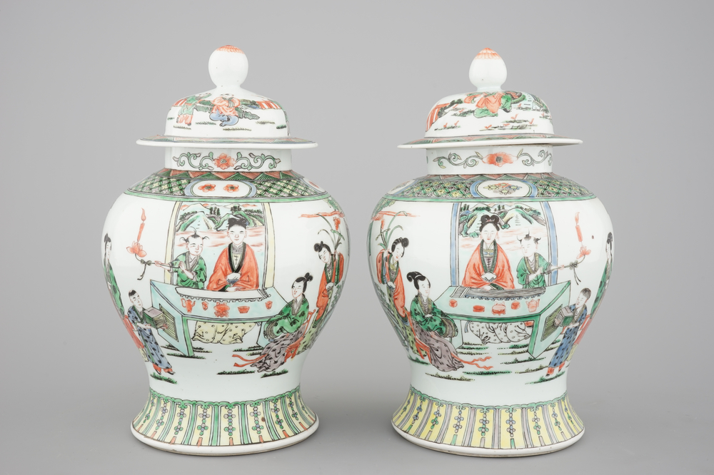 A pair of Chinese famille verte porcelain baluster vases and covers, 19th C.